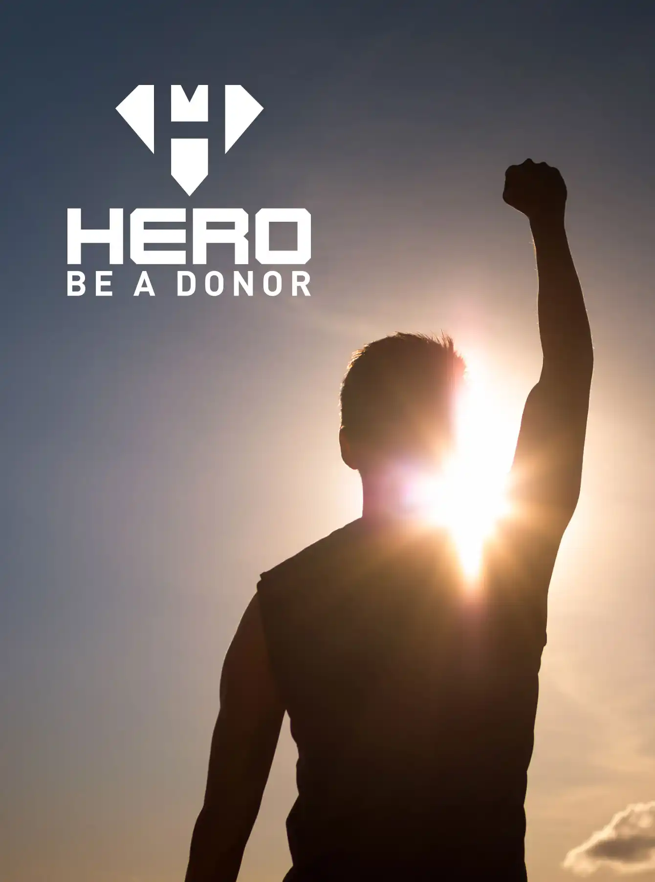Hero Be A Donor Young strong man with fist up to the sky feeling empowered, and determined.